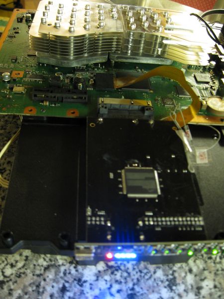 File:E3-Flasher working on open PS3 DIA-002 with heatsink.JPG