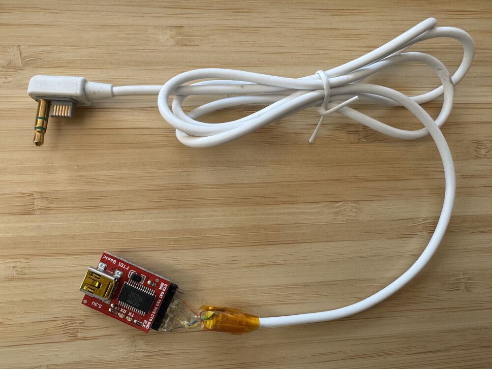 An image of a PSP-3000 headphone serial remote cable attached to a FT232RL USB to serial adapter board